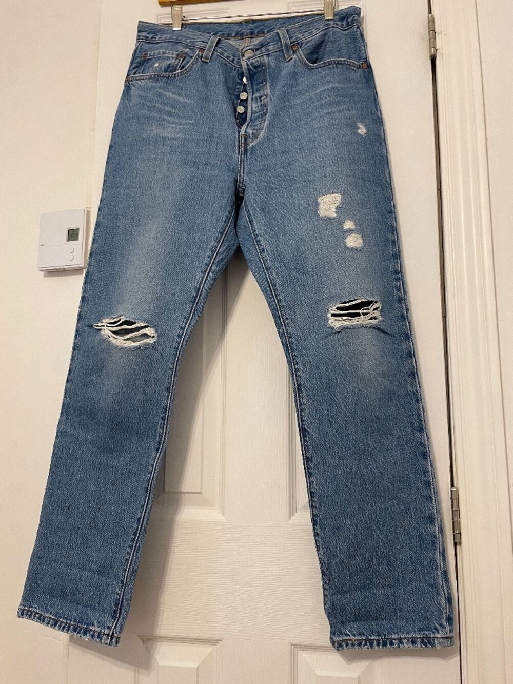 Levis / Medium Blue Distressed 501 Jeans